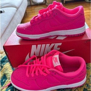 Nike dunks low in the color Hyper Pink. In great condition.